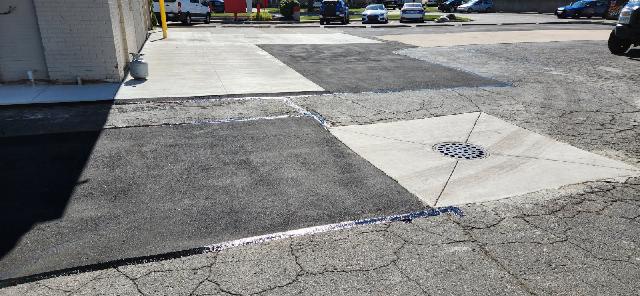 commercial parking lot patching hot rubber crack filling sealcoating and striping after patching