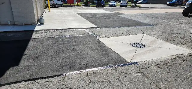 commercial parking lot patching hot rubber crack filling sealcoating and striping after patching