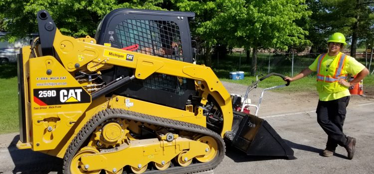 Asphalt paving equipment and a worker